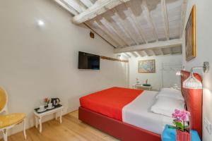 A bed or beds in a room at Residenza D'Epoca Historia Luxury Boutique