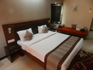 Hotel Ayodhya客房内的一张或多张床位