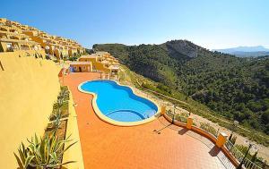 an aerial view of a swimming pool on a resort at Casa Cumbre del Sol in Benitachell
