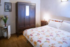 Postel nebo postele na pokoji v ubytování I Chimi Locanda di Frassino