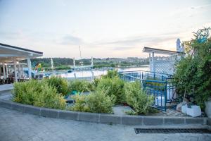 a view of a marina with a bunch of plants at Sunset Vibes in Arapya - Breathtaking Views and Pool - by Flаt Manаger in Arapya