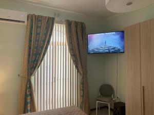 TV a/nebo společenská místnost v ubytování Cloud 9 Residence