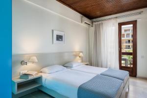 Postel nebo postele na pokoji v ubytování Magia Apartments