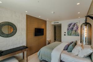 Ένα ή περισσότερα κρεβάτια σε δωμάτιο στο Boutique Hotel & Spa Casa del Mare - Mediterraneo