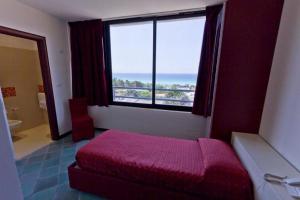 Ένα ή περισσότερα κρεβάτια σε δωμάτιο στο Hotel Baia Verde Gallipoli