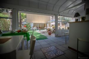 a kitchen with a view of a patio with a table at B&B Sicily Luxury in Catania
