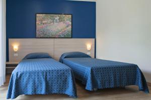 Postel nebo postele na pokoji v ubytování Hotel Garibaldi