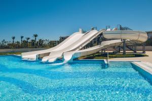 a water slide in a pool at a resort at Iberostar Selection Kuriat Palace in Monastir