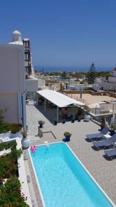 a swimming pool on the side of a building at Villa Pavlina in Karterados