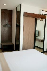 Postel nebo postele na pokoji v ubytování D'Hotel & Suites