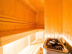 a sauna with a tub in the middle at Hotel Krystal in Luhačovice
