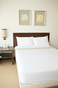 Postel nebo postele na pokoji v ubytování D'Hotel & Suites