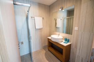 a bathroom with a sink and a shower at Mare Civitas Apartments in Chania Town +110 photos