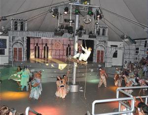 a group of performers on the stage in a circus at COCO TENT in Tuoro sul Trasimeno