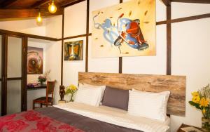 Postel nebo postele na pokoji v ubytování La Colina Hotel Cottage