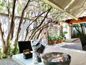 a table with a bowl on top of a table at Villa Alba Boutique Hotel in Pescara