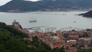 a view of a city with a ship in the water at Sea view in Lerici