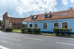 a building on the side of a road at Penzion a restaurace U Kalendů in Strážnice