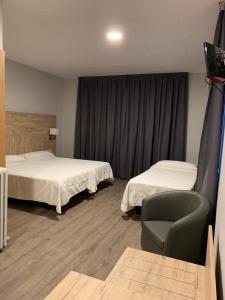 Кровать или кровати в номере Hotel Bellavista +26 фотографий