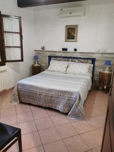 מיטה או מיטות בחדר ב-Agriturismo Pettinari