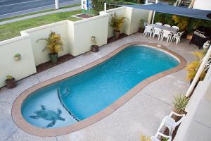 a large swimming pool with a large balcony at Best Western Caboolture Gateway Motel in Caboolture