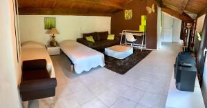 a living room with a couch and a table at Gite en Cevennes 4 personnes in Ponteils-et-Brésis