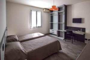 A bed or beds in a room at gambisa street