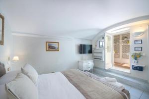 Cama ou camas em um quarto em Villa Lauro Dependance