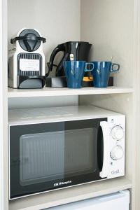 A kitchen or kitchenette at MONKÓ - BANANA & TROPYCAL APARTMENT o
