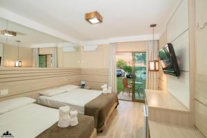 TV a/nebo společenská místnost v ubytování Thermas Hotel Mossoró