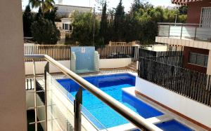 a swimming pool on a balcony of a building at Punta Prima Pleamar in Orihuela Costa