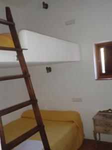 Un pat sau paturi într-o cameră la Cortijo Nuevo Alojamiento Rural