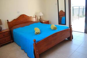 Giường trong phòng chung tại Marlin Beach Front Luxury Villa - 4 Bedrooms