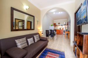 TV a/nebo společenská místnost v ubytování aloha apartments
