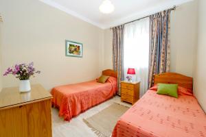 Postel nebo postele na pokoji v ubytování aloha apartments