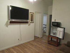 a living room with a flat screen tv on a wall at Casita in Pahrump