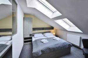 Postel nebo postele na pokoji v ubytování Aparthotel Belveder
