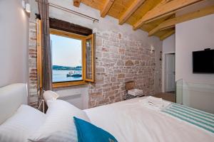 En eller flere senge i et værelse på Studio First Row to the Sea