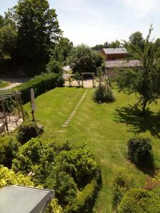 a view of a garden from the roof of a house at La Maison Du Marchand in Peyrat-le-Château