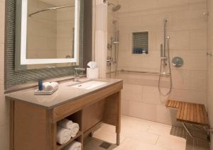 a bathroom with a sink and a shower at Zota Beach Resort in Longboat Key
