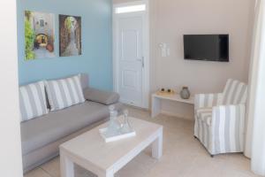 Телевизор и/или развлекательный центр в Theoxenia Chios Apartments