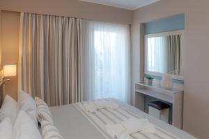 Кровать или кровати в номере Theoxenia Chios Apartments