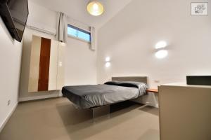 Postel nebo postele na pokoji v ubytování Corte Cairoli B&B and Suites