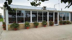 a building with potted plants on the side of it at Mas Panoli in Deltebre