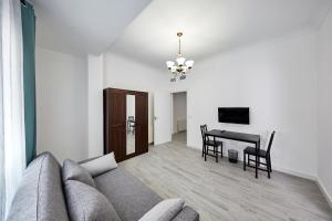 a living room with a couch and a table at New Apartment Explanada in Alicante