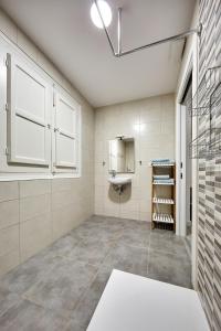 a bathroom with a sink and a toilet in it at New Apartment Explanada in Alicante