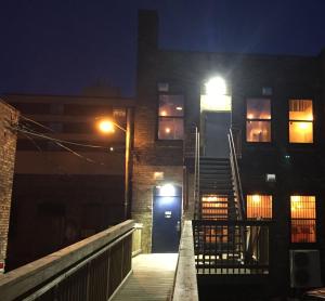 a stairway leading to a building at night at Hostel du Nord in Duluth