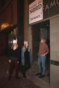 a group of people standing outside of a building at Hostel du Nord in Duluth