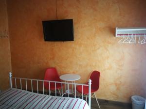 Łóżko lub łóżka w pokoju w obiekcie Hospedaje Menendez Pelayo
