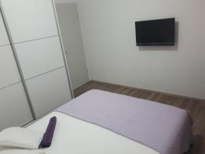 מיטה או מיטות בחדר ב-Apartment Vedran